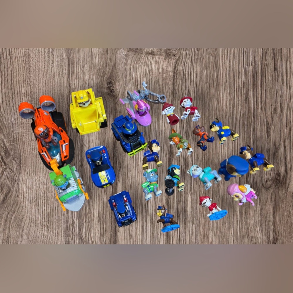 23 piece Paw Patrol miniature figures & cars, which are from various theme sets